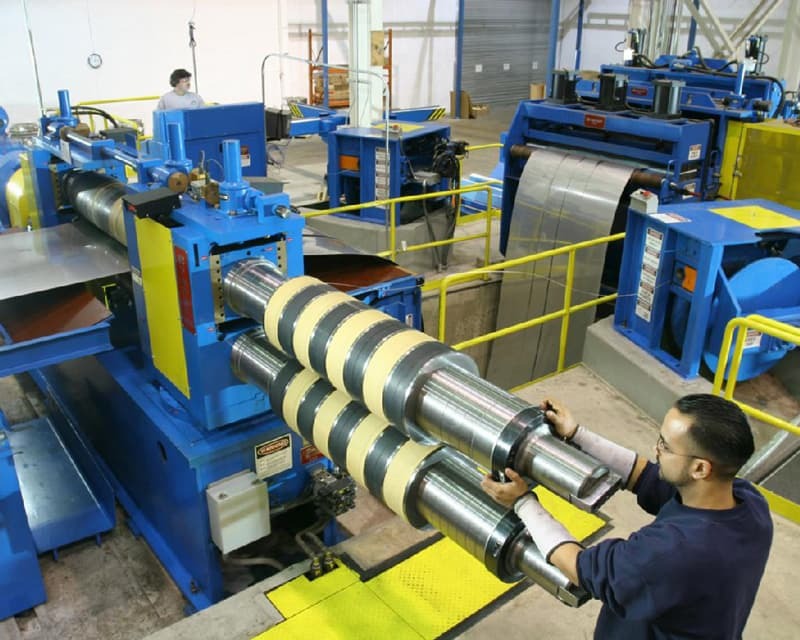 Image of warehouse worker using Braner USA metal processing equipment